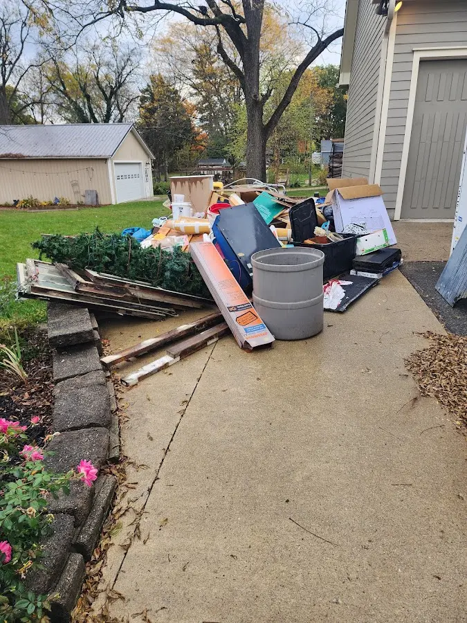 Dumpster being loaded with debris for Residential Dumpster Rental in Belton